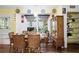 Cozy dining area with natural lighting, wooden cabinet, and decorative plates around the walls at 3948 Bright Star Rd, Douglasville, GA 30135