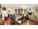 Elegant dining room featuring hardwood floors, a large table setting, and easy access to the living room at 3948 Bright Star Rd, Douglasville, GA 30135