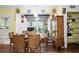 Charming dining room with a glass table, seating for six, and a built-in display cabinet at 3948 Bright Star Rd, Douglasville, GA 30135