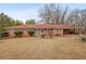Charming single-story brick home featuring a well-maintained lawn and a convenient carport at 3948 Bright Star Rd, Douglasville, GA 30135