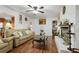 Bright living room with a cozy fireplace, hardwood floors, and comfortable seating area at 3948 Bright Star Rd, Douglasville, GA 30135