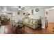 Spacious living room with comfortable seating and hardwood floors features a ceiling fan and bright lighting at 3948 Bright Star Rd, Douglasville, GA 30135