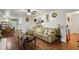 Spacious living room with hardwood floors, a comfortable sectional sofa, and easy access to the dining area at 3948 Bright Star Rd, Douglasville, GA 30135