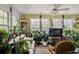 Cozy sunroom with lots of plants and natural light at 3948 Bright Star Rd, Douglasville, GA 30135
