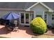 Outdoor patio with dining set, grill, and lush surroundings that is perfect for entertaining friends and Gathering at 142 Carl Barrett Dr, Canton, GA 30115