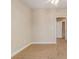 Cozy bedroom featuring neutral walls, tan carpet, and a door leading to closet or bathroom at 2201 Stratford Commons, Decatur, GA 30033