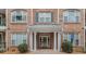 Welcoming building entrance featuring brick facade, elegant columns, and disability access at 2201 Stratford Commons, Decatur, GA 30033