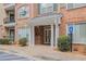 Welcoming building entrance featuring brick facade, elegant columns, and disability access at 2201 Stratford Commons, Decatur, GA 30033