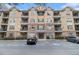 A stately condo building features a meticulously maintained facade and well-manicured landscaping at 2201 Stratford Commons, Decatur, GA 30033