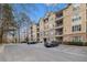 Multi-level condo building offers convenient parking and timeless elegance with its manicured landscaping at 2201 Stratford Commons, Decatur, GA 30033