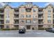 A stately condo building features a meticulously maintained facade and well-manicured landscaping at 2201 Stratford Commons, Decatur, GA 30033