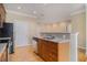 Spacious kitchen showing hardwood floors and view to living room at 2201 Stratford Commons, Decatur, GA 30033
