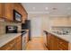 Modern kitchen with stainless steel appliances and wooden cabinets at 2201 Stratford Commons, Decatur, GA 30033