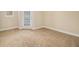 Empty Living room with a sliding glass door for access to the patio at 2201 Stratford Commons, Decatur, GA 30033