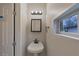 Small bathroom features a pedestal sink, mirror, and plenty of light at 2236 Brannen Se Rd, Atlanta, GA 30316