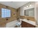 Cozy bathroom including a tub and shower with charming tile accents at 2236 Brannen Se Rd, Atlanta, GA 30316