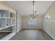 The dining area includes a modern chandelier and wainscotting at 2236 Brannen Se Rd, Atlanta, GA 30316
