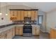 Modern kitchen features granite countertops, stainless steel appliances, and updated cabinetry at 2236 Brannen Se Rd, Atlanta, GA 30316