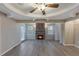 Spacious living area featuring a stone fireplace, recessed lighting, and hardwood floors at 2236 Brannen Se Rd, Atlanta, GA 30316