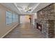 Living room features beautiful stone fireplace, tray ceiling, and plenty of natural light at 2236 Brannen Se Rd, Atlanta, GA 30316