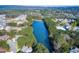 Scenic aerial view of the community lake surrounded by lush trees and beautiful homes at 1209 Lakeside Overlook, Canton, GA 30114