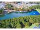 Scenic aerial view of the community pond surrounded by lush trees and beautiful homes at 1209 Lakeside Overlook, Canton, GA 30114