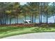 Lakeside view with a wooden dock and many trees at 1209 Lakeside Overlook, Canton, GA 30114