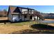 This home has a spacious, green backyard with a trampoline and deck at 1350 Cedars Rd, Lawrenceville, GA 30045