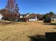 Large backyard with level terrain and rear deck with stair access at 1350 Cedars Rd, Lawrenceville, GA 30045