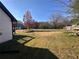Spacious, level backyard, partially fenced with deck and exterior stairs at 1350 Cedars Rd, Lawrenceville, GA 30045