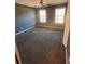 Bedroom featuring neutral walls, carpet floors, ceiling fan, and natural lighting at 1350 Cedars Rd, Lawrenceville, GA 30045
