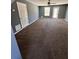 Bright bedroom with a ceiling fan, natural light, and neutral carpet at 1350 Cedars Rd, Lawrenceville, GA 30045