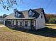 Charming two-story home with covered porch, dormer windows, and attached garage at 1350 Cedars Rd, Lawrenceville, GA 30045