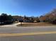 Exterior shot of home featuring covered porch, dormer windows, and large front lawn at 1350 Cedars Rd, Lawrenceville, GA 30045