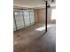 Spacious garage interior with concrete floor and white paneled garage door at 1350 Cedars Rd, Lawrenceville, GA 30045