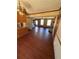 Bright, open-concept living area with hardwood floors, ceiling fan, and windows for natural light at 1350 Cedars Rd, Lawrenceville, GA 30045