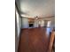 Spacious living room with hardwood floors, a cozy fireplace, and windows for natural light at 1350 Cedars Rd, Lawrenceville, GA 30045