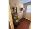 Utility room with water heater, cabinet, and hardwood-style floor at 1350 Cedars Rd, Lawrenceville, GA 30045