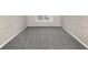 Unfurnished bedroom with wall trim and window at 6422 Pinebark Way, Morrow, GA 30260