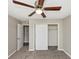Comfortable bedroom with a ceiling fan and a closet at 6422 Pinebark Way, Morrow, GA 30260