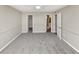 Large bedroom with neutral walls and carpeted floor at 6422 Pinebark Way, Morrow, GA 30260