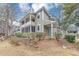 Charming home featuring a screened porch, balcony, and manicured landscaping at 6422 Pinebark Way, Morrow, GA 30260