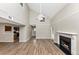 Open-concept living space featuring a fireplace and hardwood floors at 6422 Pinebark Way, Morrow, GA 30260