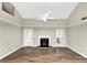 Spacious living room featuring a fireplace and stylish wood flooring at 6422 Pinebark Way, Morrow, GA 30260