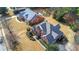 A high aerial shot showcases the home's roof, landscaping, and proximity to neighboring properties at 1027 Eagles Brooke Dr, Locust Grove, GA 30248