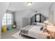 Shared bedroom showcasing two beds, vaulted ceiling, and natural light from two windows at 1027 Eagles Brooke Dr, Locust Grove, GA 30248
