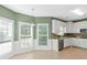 Bright kitchen nook with large windows and white cabinetry at 1027 Eagles Brooke Dr, Locust Grove, GA 30248