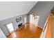 Bright living room featuring hardwood floors, fireplace, and an open layout connected to the kitchen at 1027 Eagles Brooke Dr, Locust Grove, GA 30248