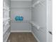 Walk-in closet with ample shelving and storage space at 1027 Eagles Brooke Dr, Locust Grove, GA 30248