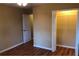 Bedroom featuring hardwood floors, a ceiling fan, and a spacious closet at 5901 Club Se Dr, Mableton, GA 30126
